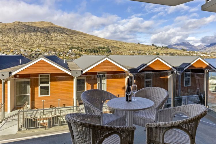 Patio with mountain and partial lake view