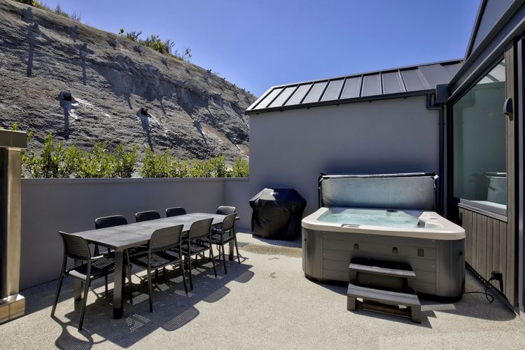 Back patio with spa, BBQ and dining table