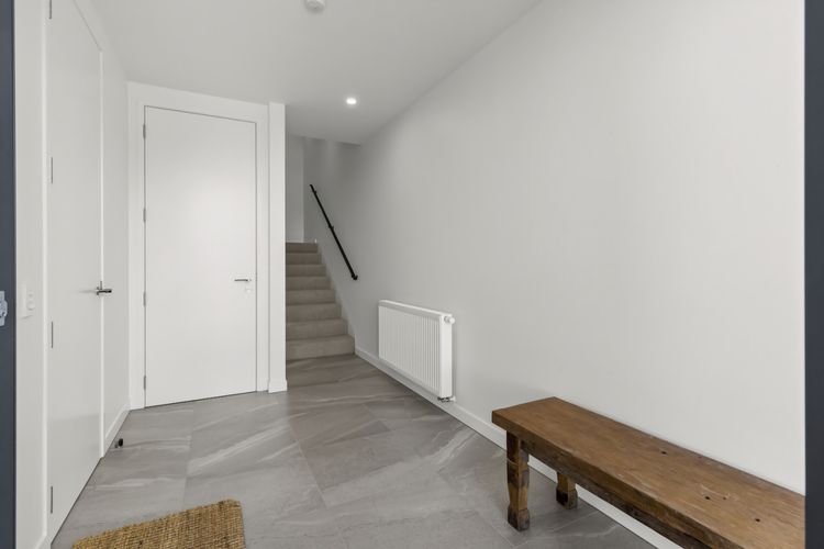 Entrance with access to garage and ski cupboard