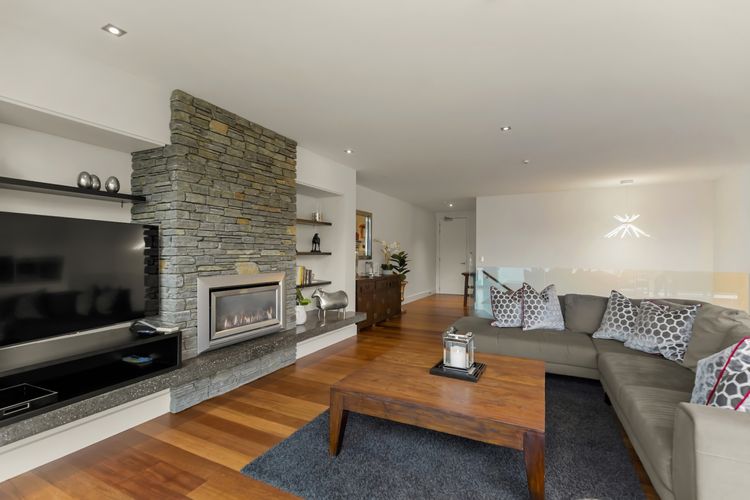 Cosy living area with 50 inch smart TV and gas fireplace