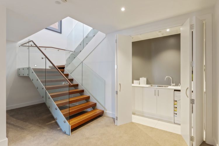 Entrance with fully equipped laundry