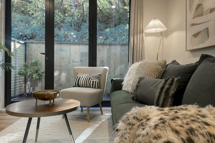 Comfortable living area with small outdoor couryard and smart TV