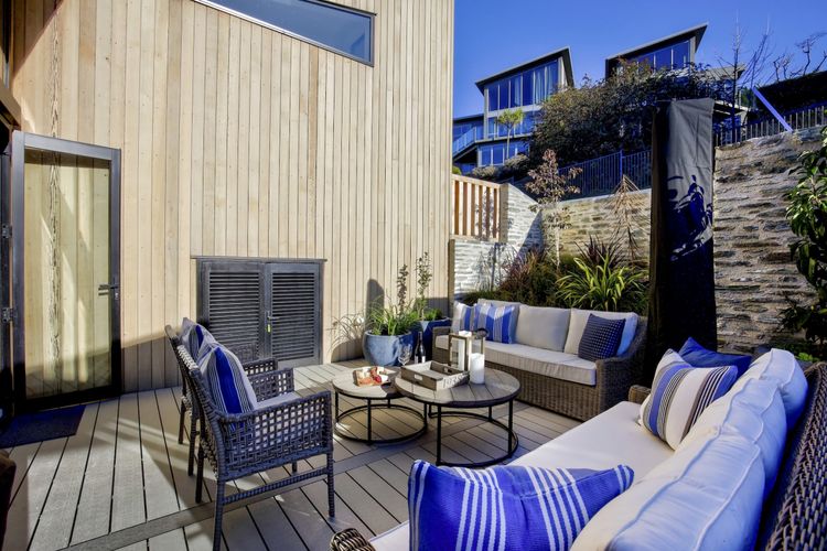 Sunny and sheltered courtyard with sun umbrella