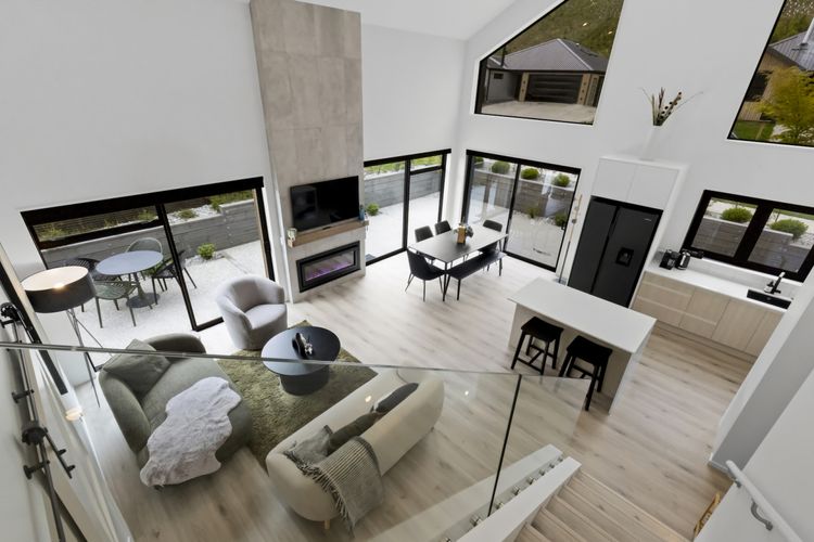 Open plan living with gas fireplace and aircon/heatpump