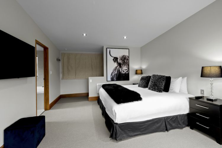 Master ensuite bedroom with king bed