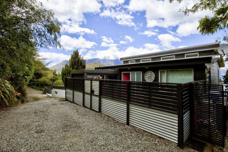 Exterior of the property - access front and side with carpark to the right of this photo