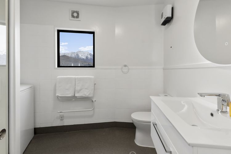 Bathroom with shower and full laundry