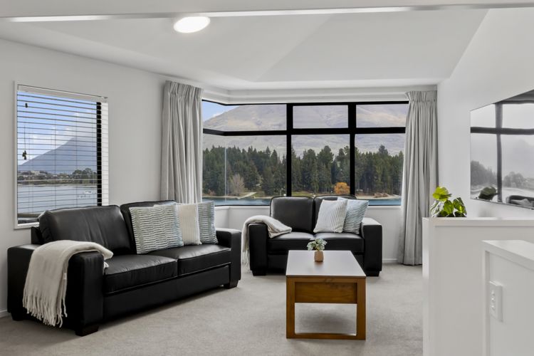 Living area with lake and mountain views