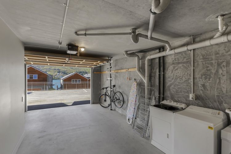 Single garage for parking and bike/ski storage and full laundry with washer and dryer