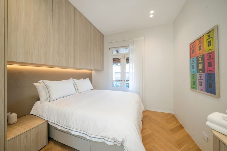 Comfortable queen bed with soft linens for a restful night's sleep.