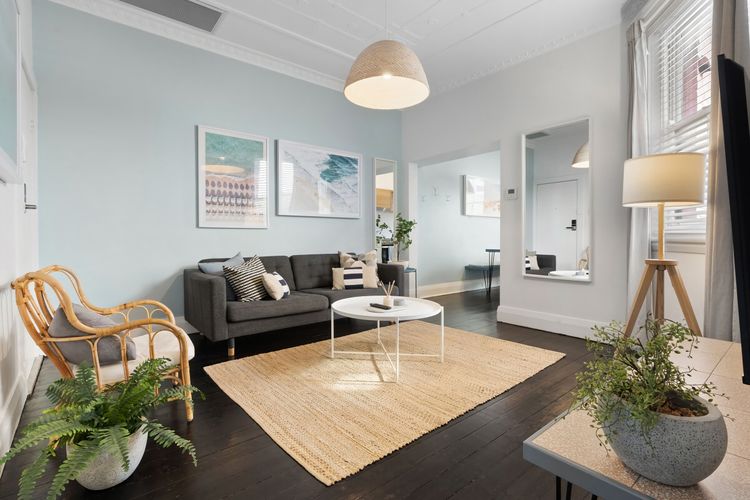 Bright and airy living room with a blend of modern comfort, perfect for unwinding after a day at the beach.