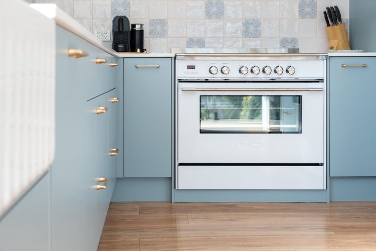 Kitchen with Oven and Blue Cabinets