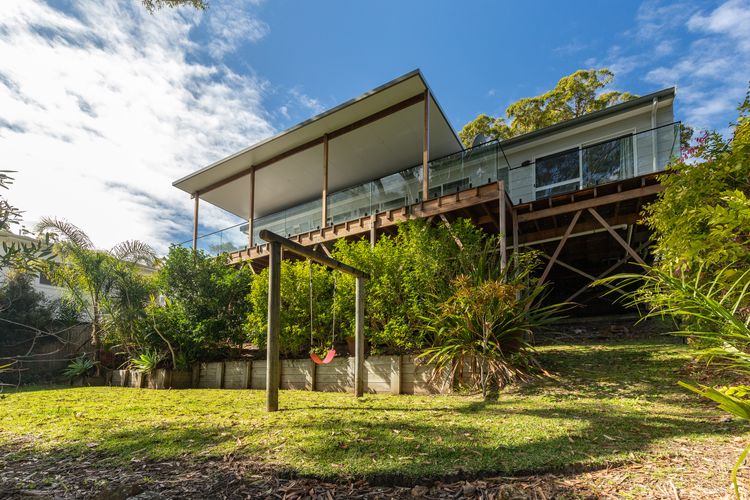 Exterior View of House with Elevated Deck