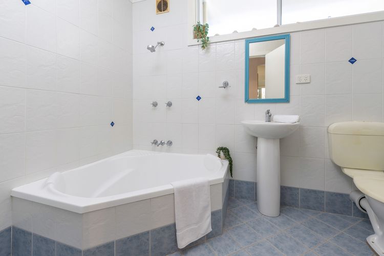 Corner bath rub & shower U/Stairs
