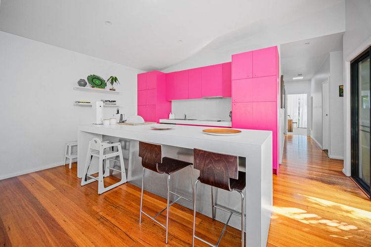 Kitchen with Breakfast Bar and Pink Accents