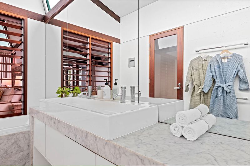 Marble bathroom with robes and towels