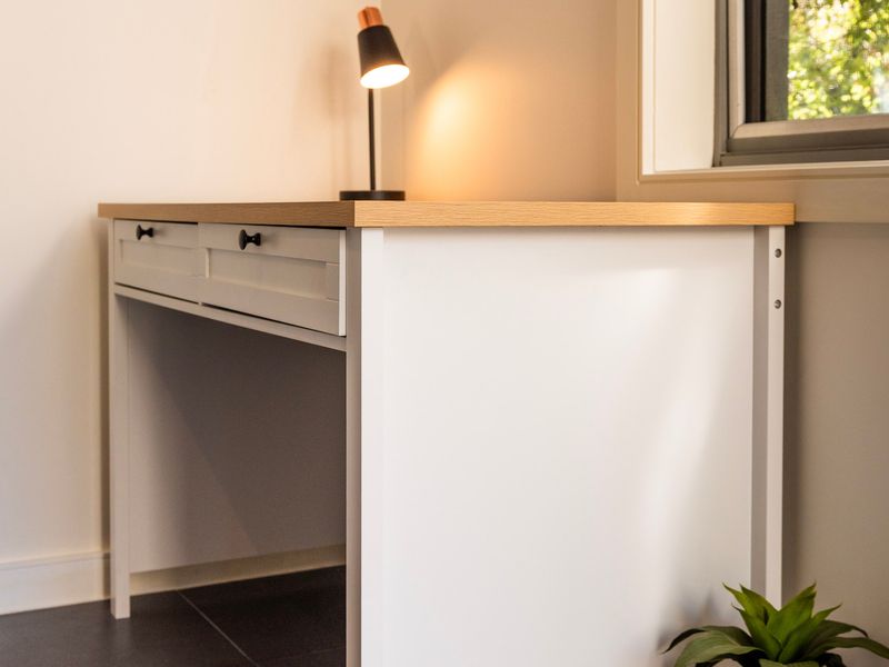 Built-in kitchen counter and cabinetry nook offering clean lines and functional workspace.