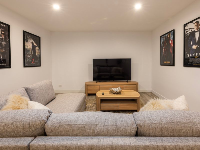 Cosy lounge surrounded by framed artwork