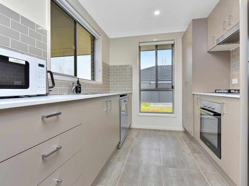 Fully equipped kitchen with modern appliances and ample counter space