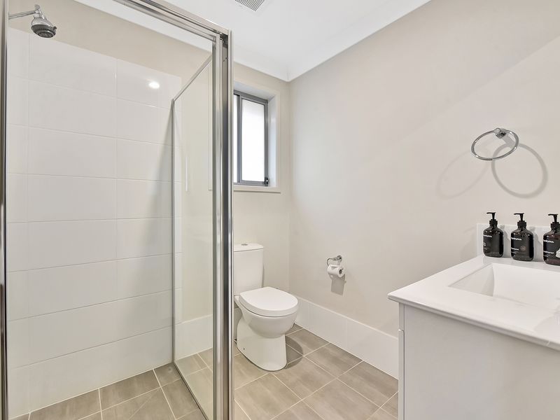 Clean and modern bathroom with walk-in shower