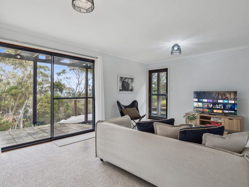 Second living area ideal for reading or winding down.