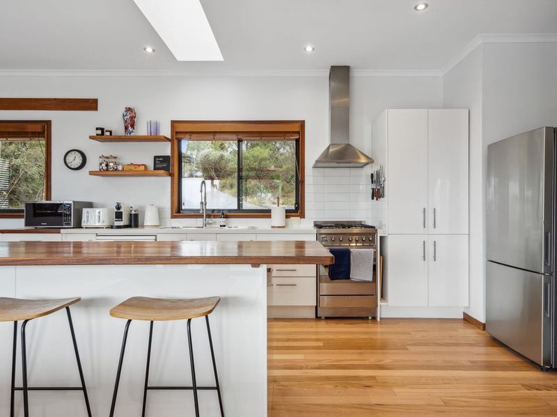Fully equipped kitchen with modern appliances.