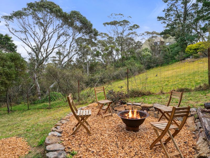 Outdoor fire pit perfect for cool mountain evenings.