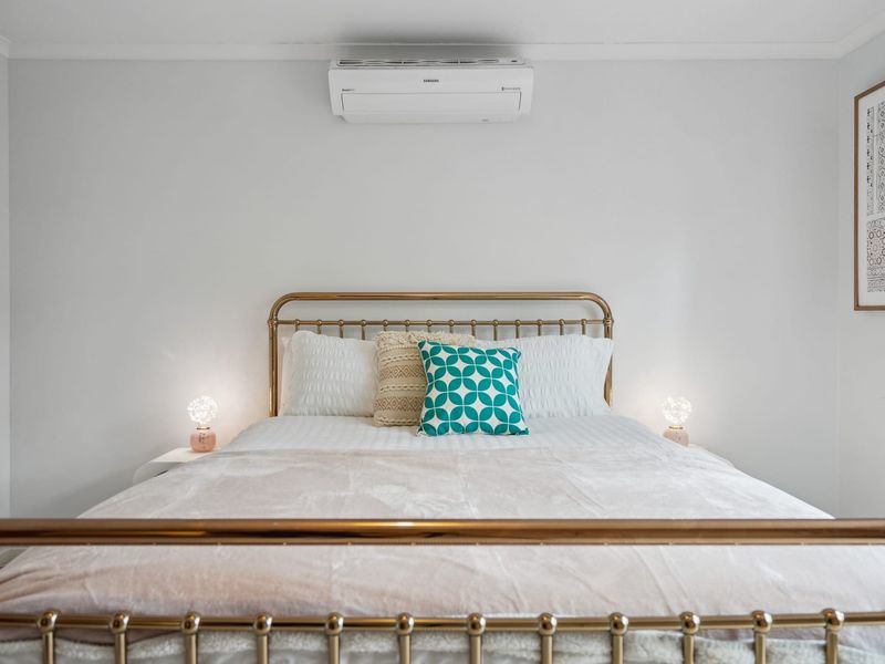 Light-filled bedroom featuring soft, airy tones.