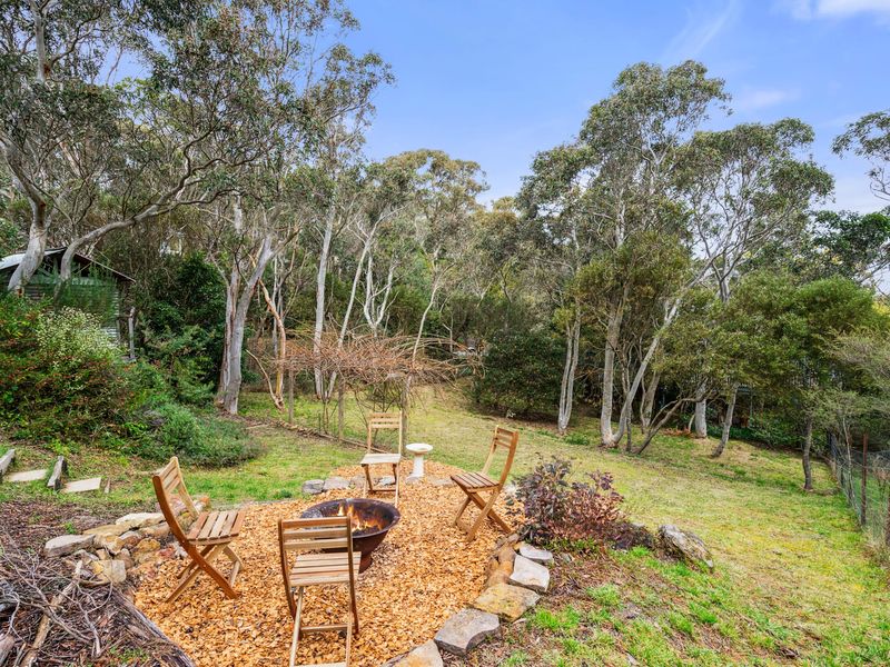 Cozy backyard fire pit area for relaxed nights under the stars.
