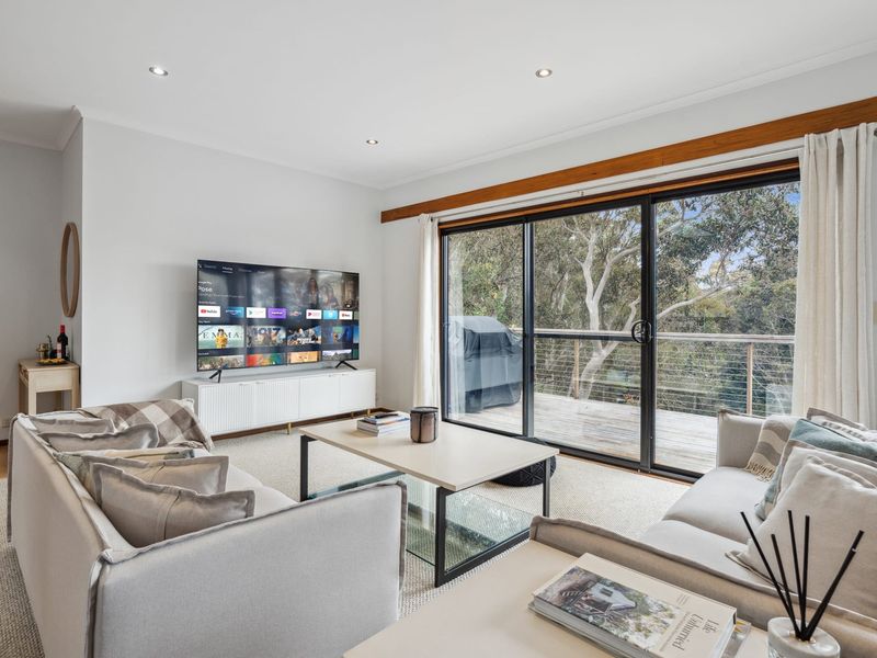 Warm lounge space with comfy seating and natural light.