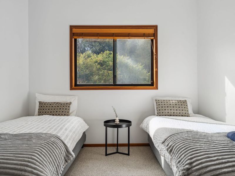 Twin bedroom with two single beds for flexible sleeping.