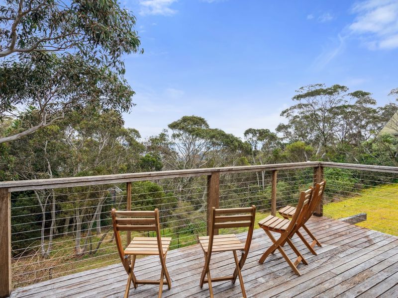 Outdoor deck area with leafy views and space to relax.