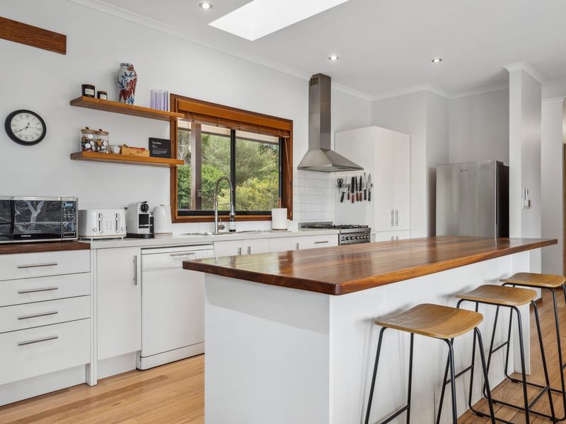 Well equipped kitchen featuring a spacious island with bar seating.