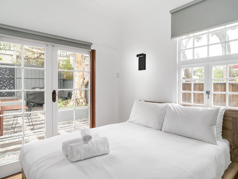 Ensuite Bedroom with large doors opening directly onto the garden.