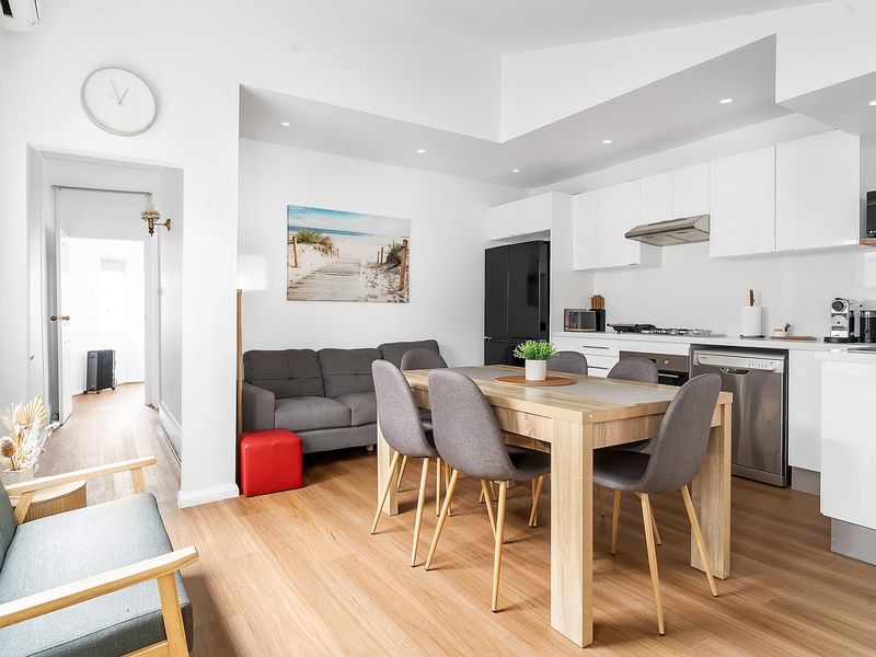 Open-plan living area combining the lounge, dining, and kitchen.