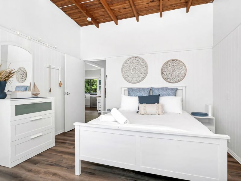 A bright and airy primary bedroom.