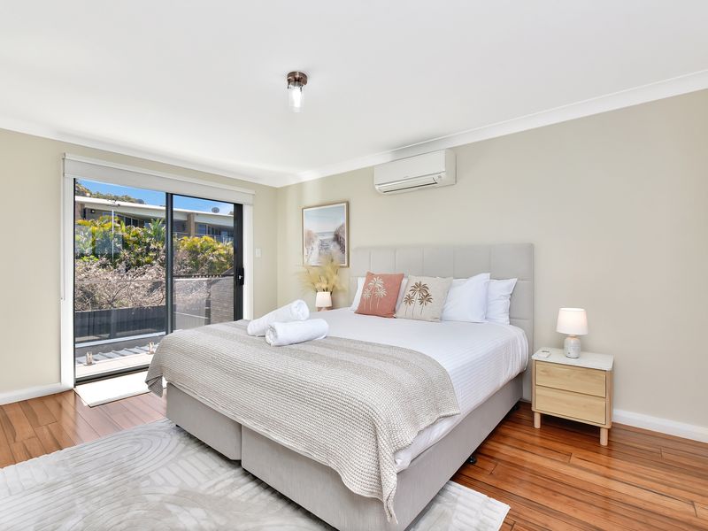 Large windows fill the room with natural light, creating a calm and relaxing atmosphere.