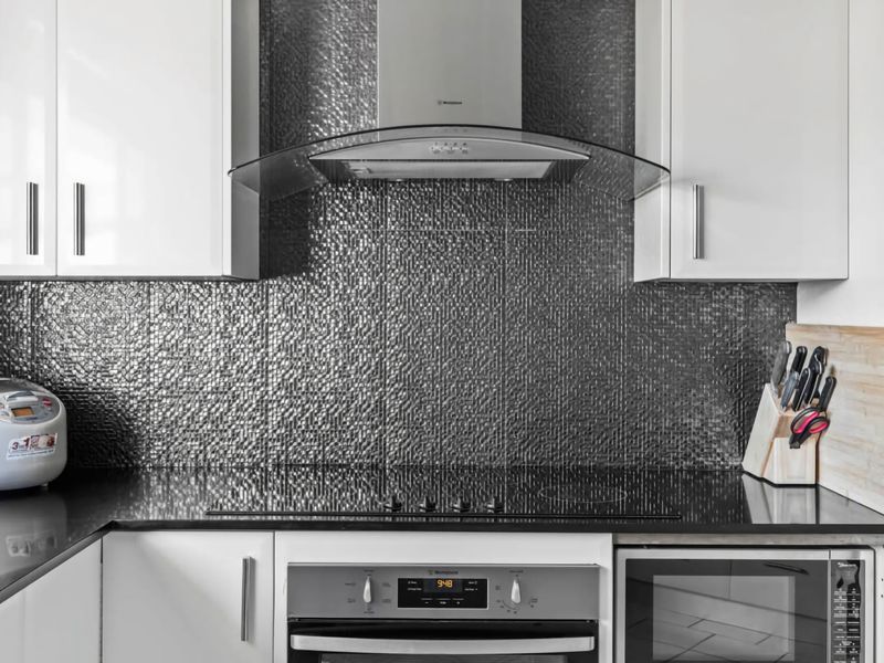 Kitchen featuring an induction stovetop for easy home-style cooking.