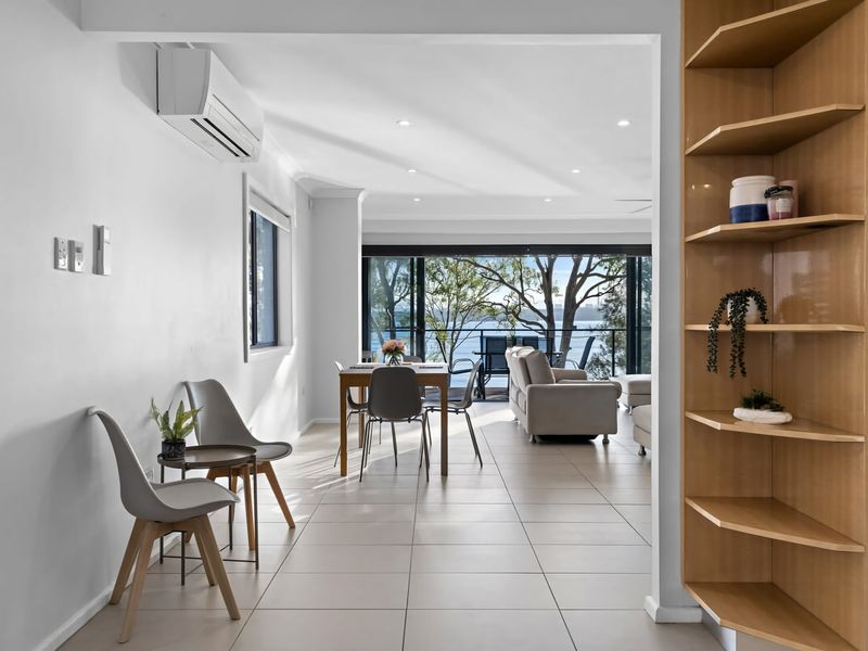Bright hallway leading to the main living spaces.