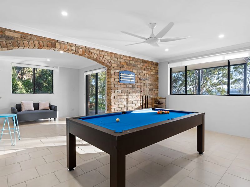 Fun games room with pool table and casual lounge space.