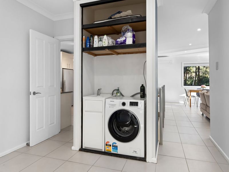 Internal laundry with washer and storage for longer stays.