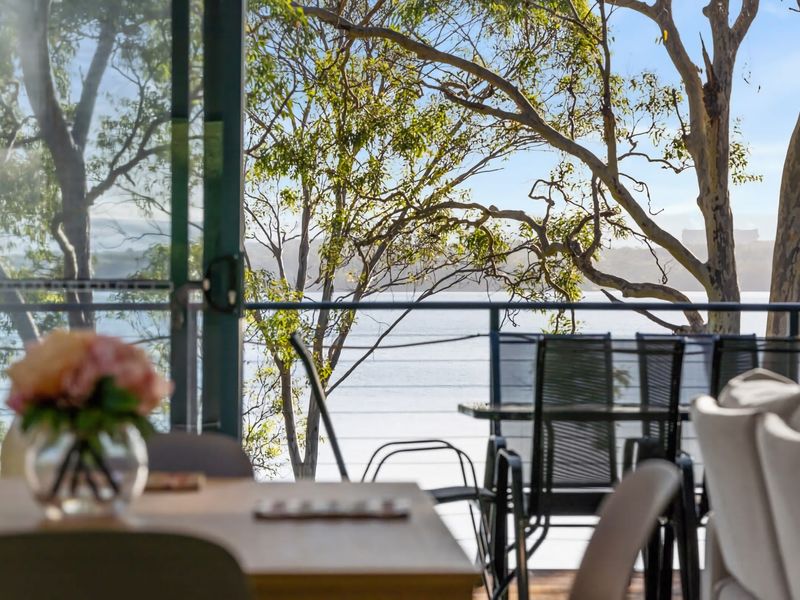 Enjoy your morning coffee with relaxing treetop and water views.
