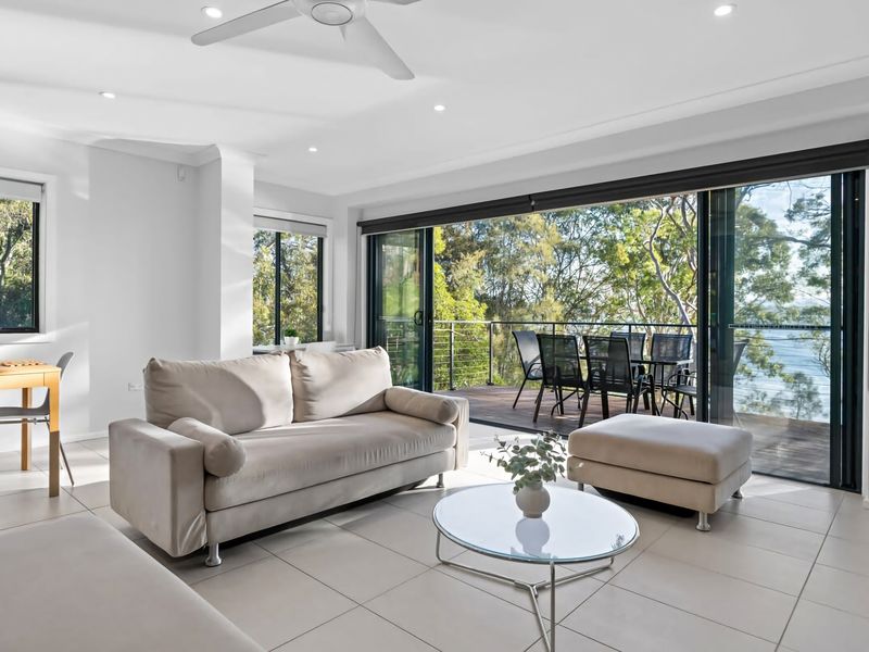 Light-filled living area opening to a private balcony.