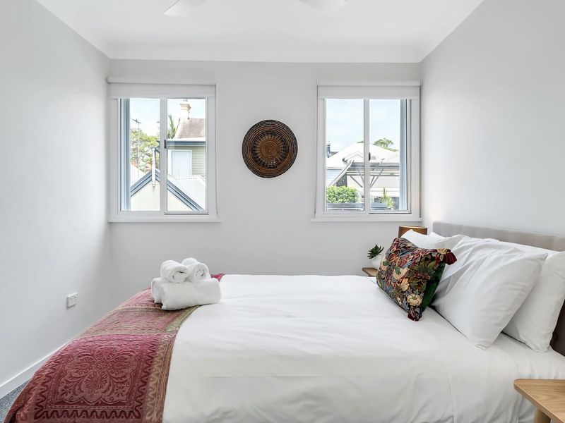 Bedroom filled with natural light, offering a wonderful way to wake up in Sydney.