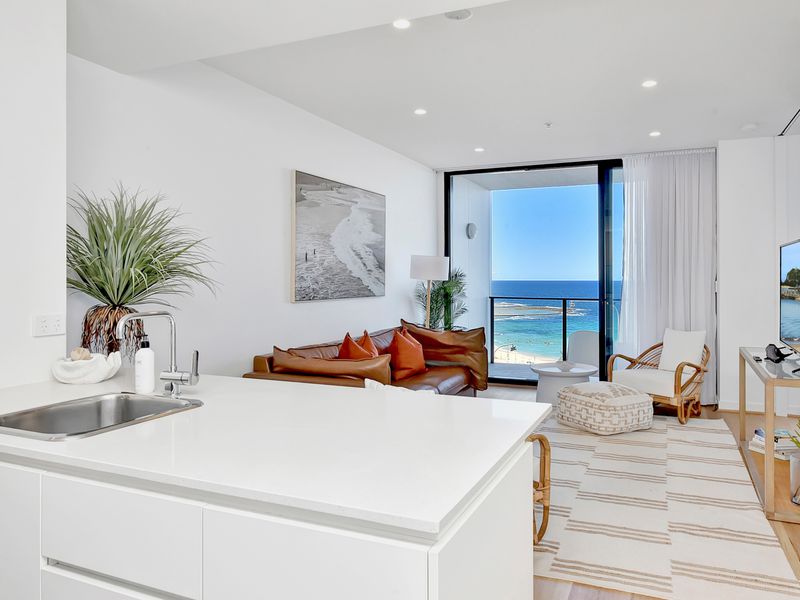 Modern open plan space with ocean views, stylish furnishings and a bright coastal feel.