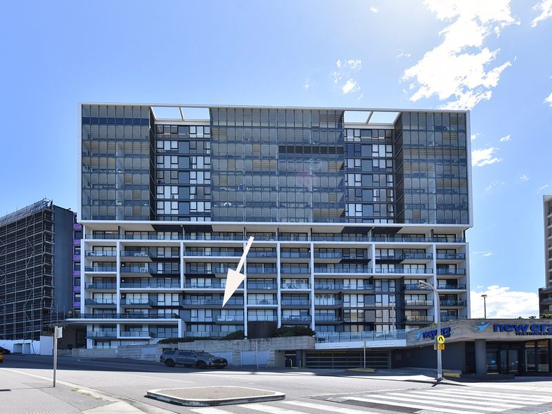 Experience sleek urban design in this modern apartment building, featuring expansive glass facades and well-appointed balconies.