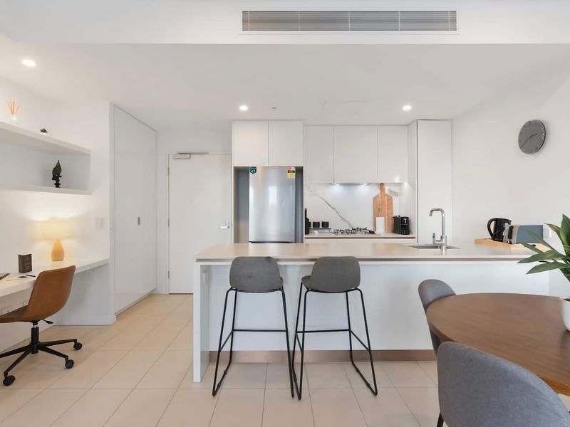 The kitchen area boasts high quality stainless-steel appliances (as shiny and new as the apartment itself!) including an electric oven, gas stove-top and dishwasher.