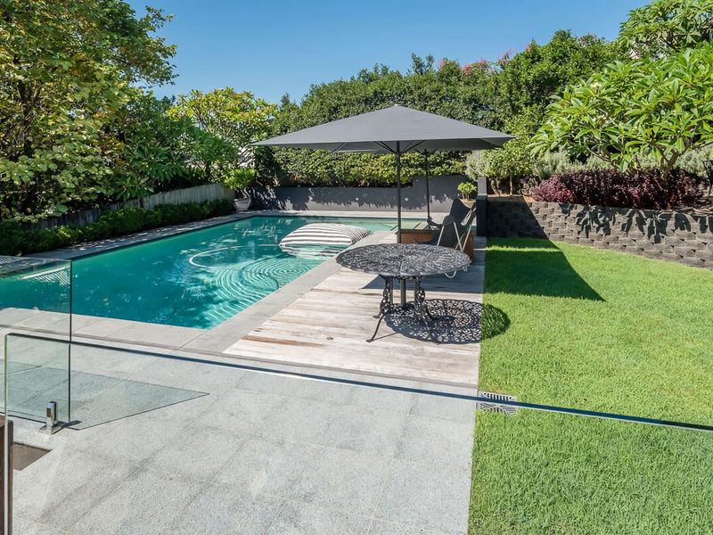 Lush green lawns surround the property