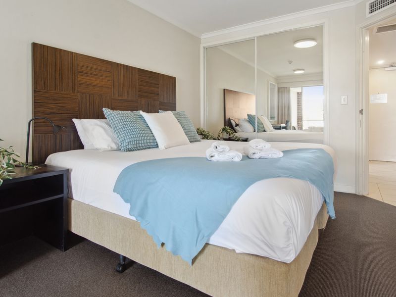 Comfortable bedroom with plush bedding