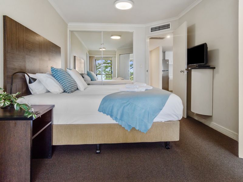 Comfortable bedroom with plush bedding